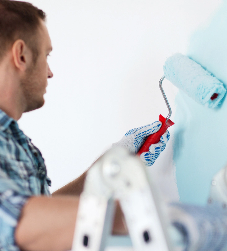 painter painting over white wall